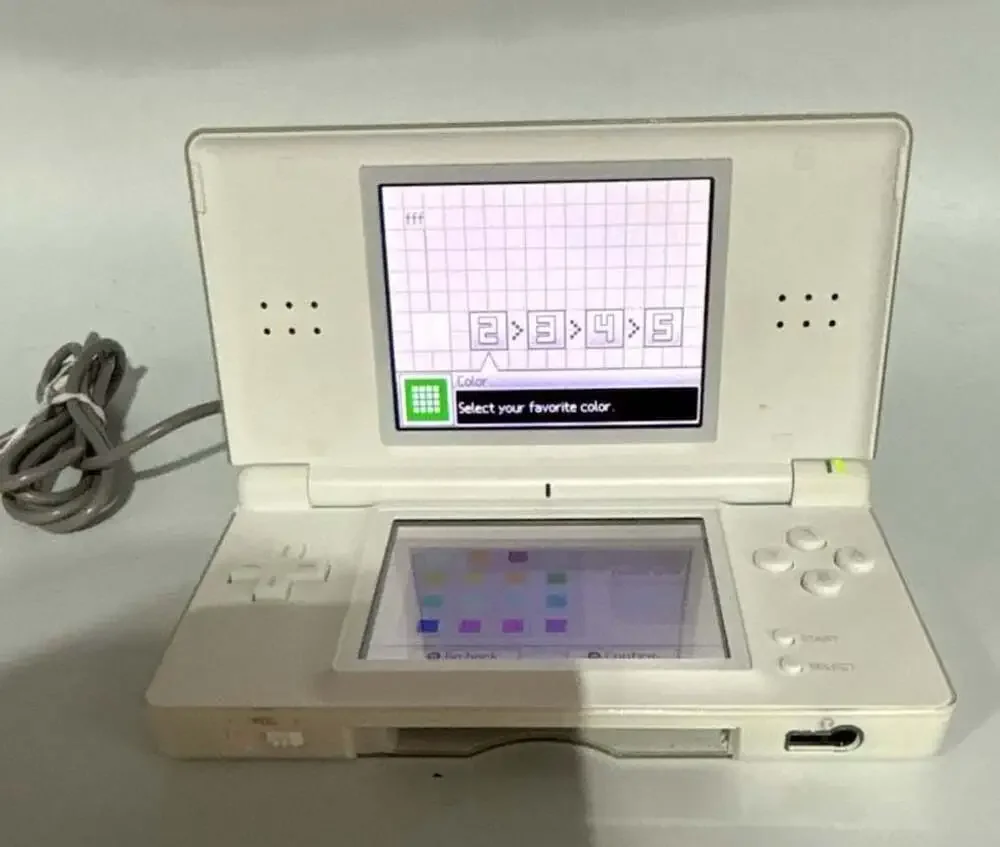 Nintendo DS Lite Polar White Handheld Console with Charger, Case, and 6 Games